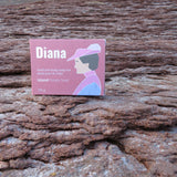 Diana brand product packaging on a wooden surface