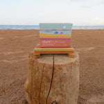 Box of Island Potato Soap on a wooden block with a beach background