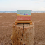 Box of Island Potato Soap on a wooden block with a beach background