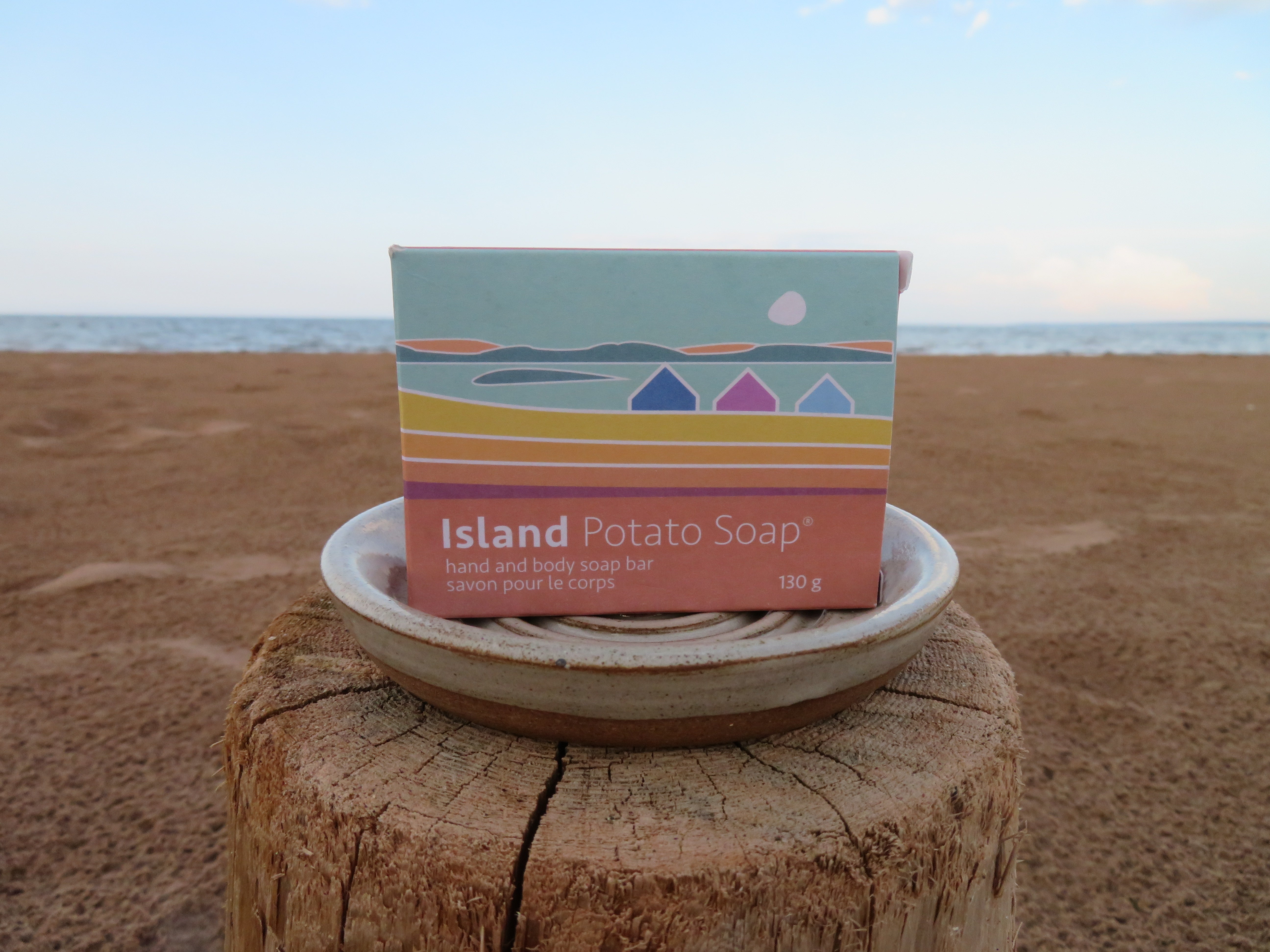 Island Potato Soap packaging on a beach with ocean view