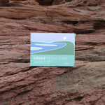 Box of Island Potato Soap on a textured stone surface