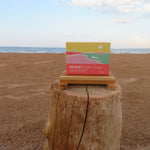 Box of Island Potato Soap on a wooden block with ocean and sky in the background