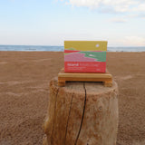 Box of Island Potato Soap on a wooden block with ocean and sky in the background